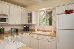 The kitchen is well-equipped with modern appliances and has a drip coffee maker and K-cup coffee maker for those quiet Sedona sunrises